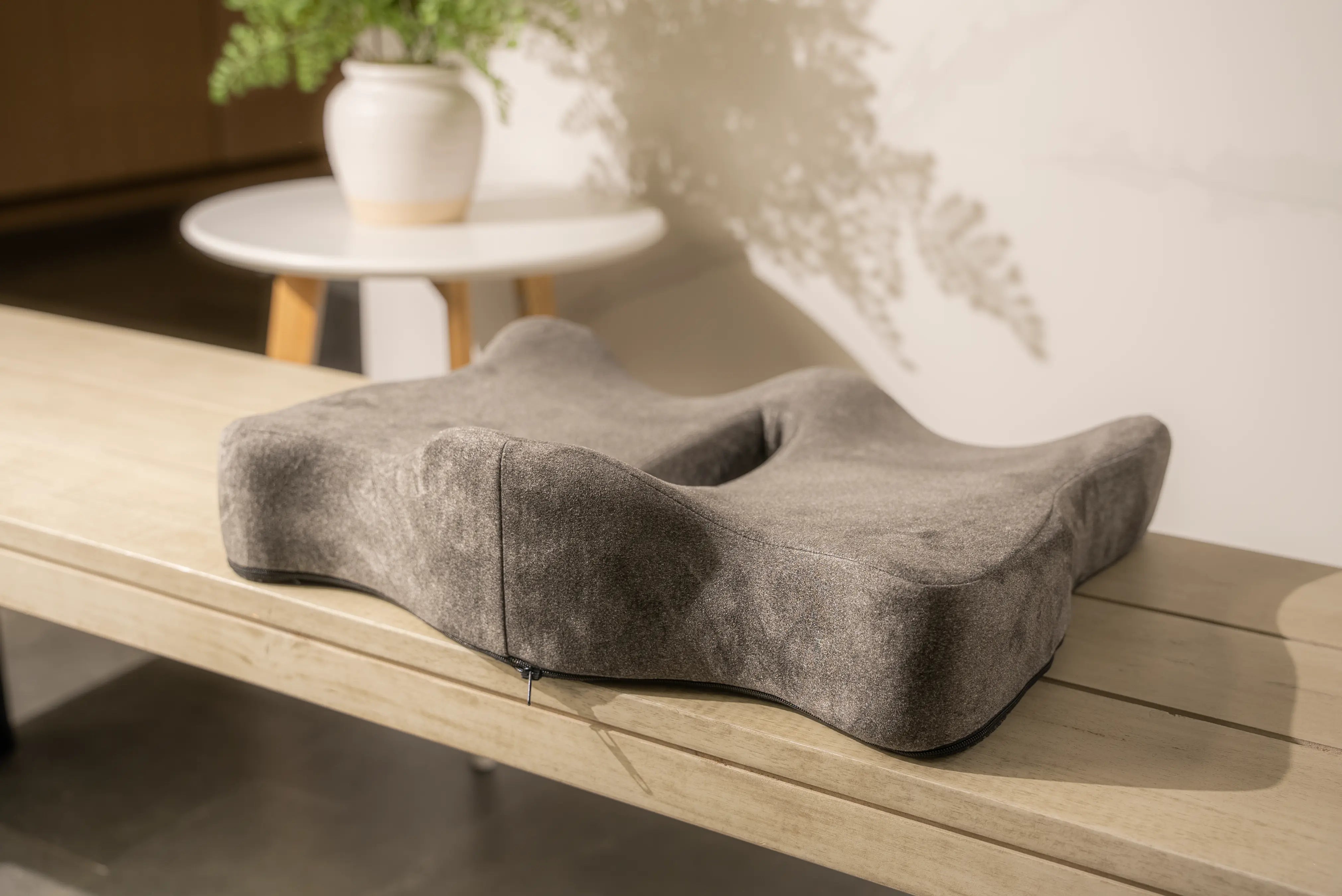 Sutera ortho cushion on a wooden bench.